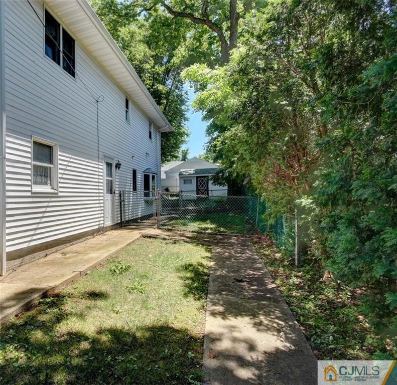 139 East Cliff Road Colonia, NJ 07067 - Photo 19 of 24 a view of a house with a yard