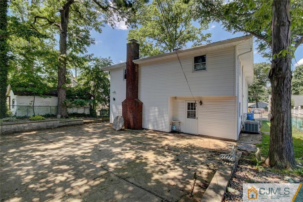139 East Cliff Road Colonia, NJ 07067 - Photo 21 of 24 a view of a house with a yard and large tree