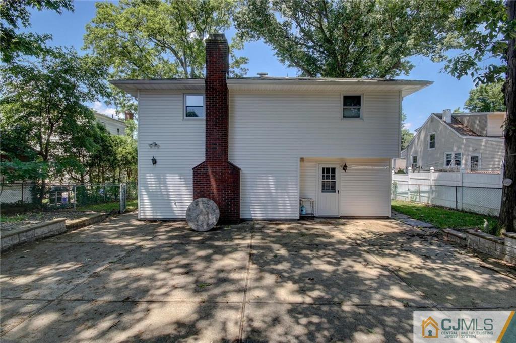 139 East Cliff Road Colonia, NJ 07067 - Photo 22 of 24 a view of a house with a yard
