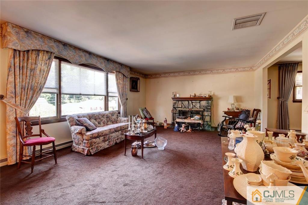 139 East Cliff Road Colonia, NJ 07067 - Photo 4 of 24 a living room with furniture and a large window
