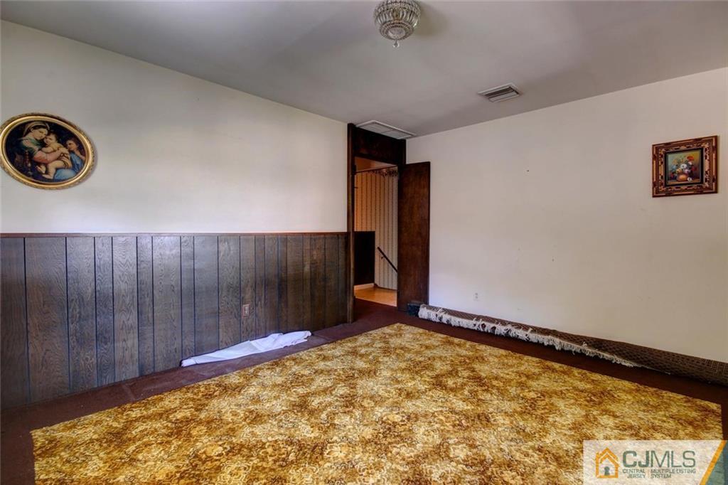 139 East Cliff Road Colonia, NJ 07067 - Photo 5 of 24 a view of a room with a wooden floor