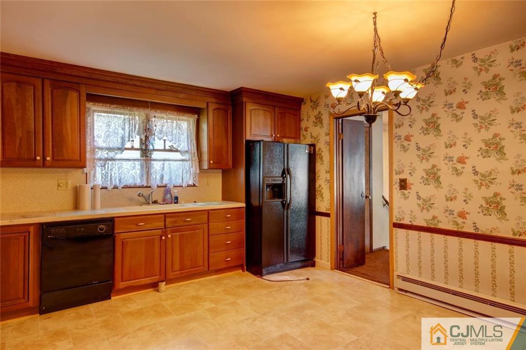 139 East Cliff Road Colonia, NJ 07067 - Photo 6 of 24 a kitchen with stainless steel appliances granite countertop a refrigerator and a sink