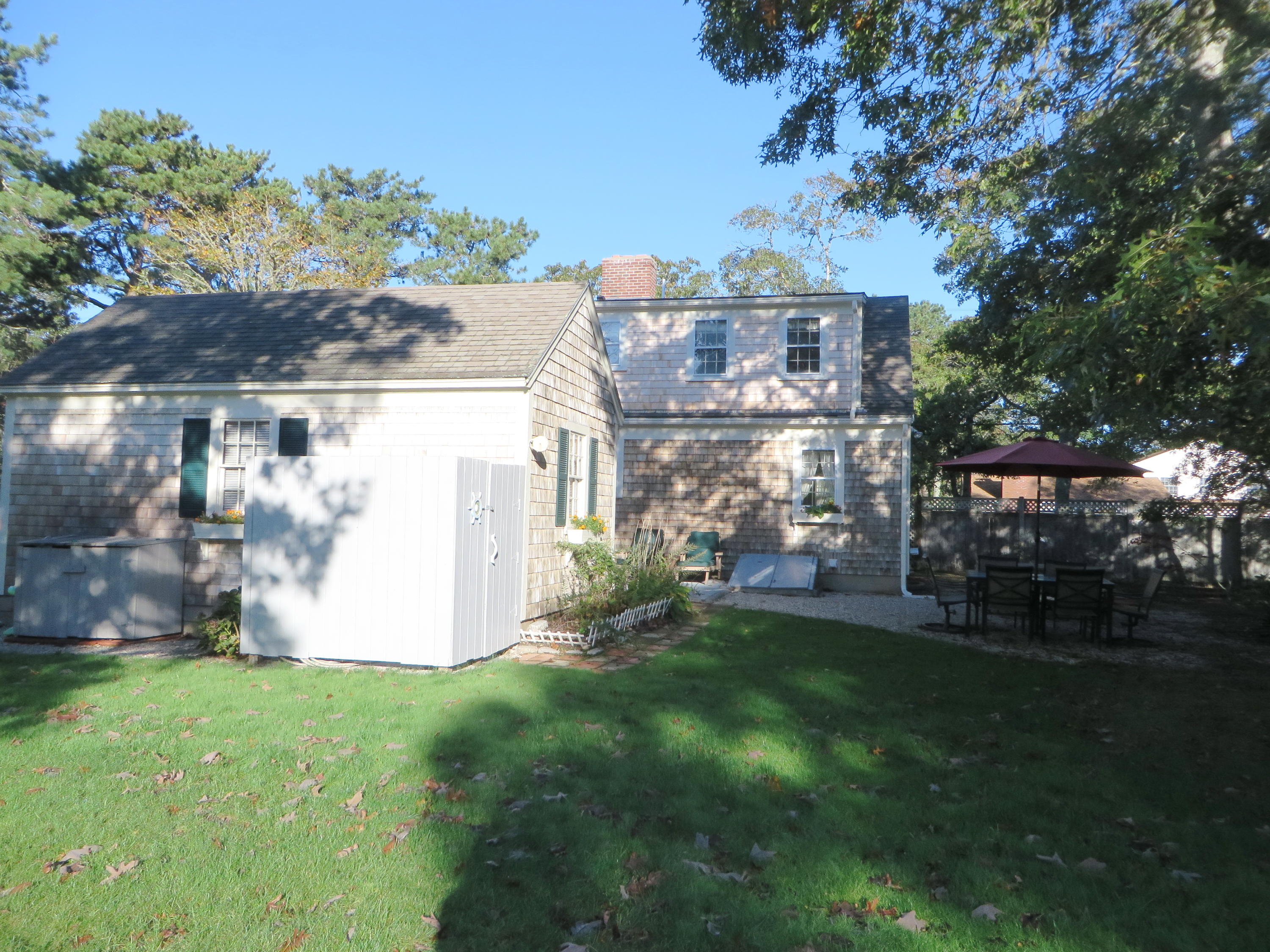 229 Lower County Road West Harwich, MA 02671 - Photo 20 of 23 a view of a back yard of the house