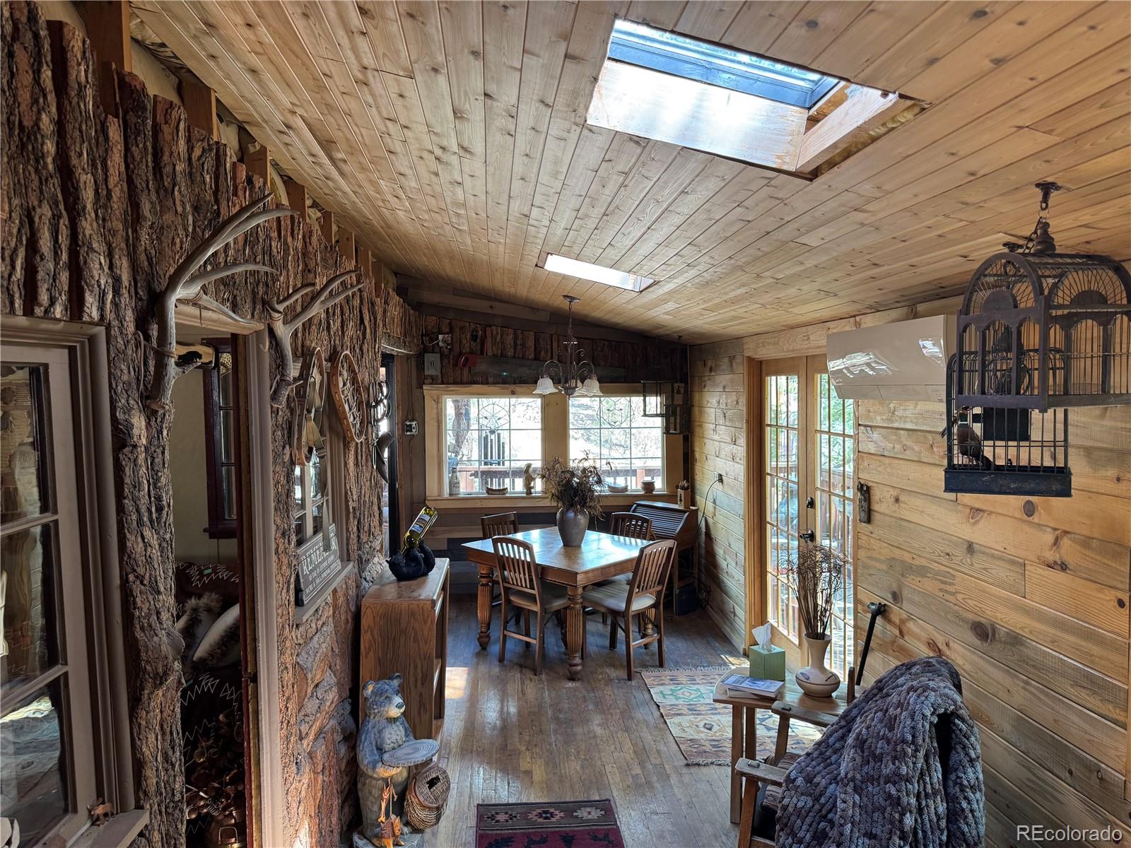 15751 South Elk Creek Road Pine, CO 80470 - Photo 15 of 34 a living room with furniture and a large window