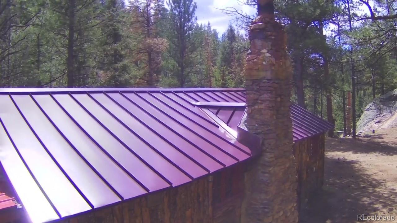 15751 South Elk Creek Road Pine, CO 80470 - Photo 34 of 34 a view of backyard with a wooden fence