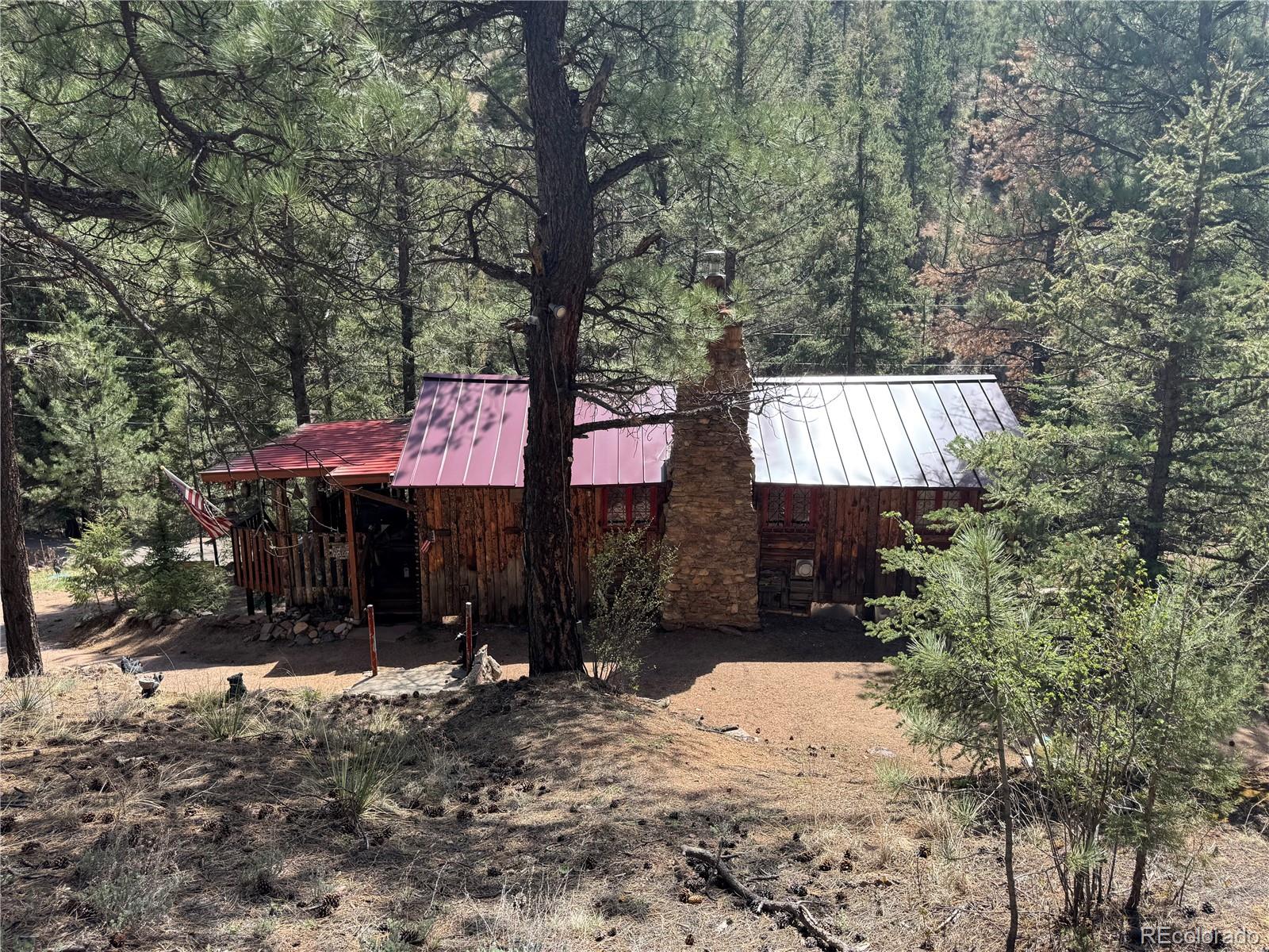 15751 South Elk Creek Road Pine, CO 80470 - Photo 4 of 34 a front view of a house