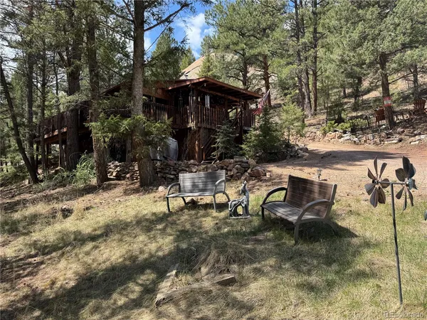 a view of a backyard of the house