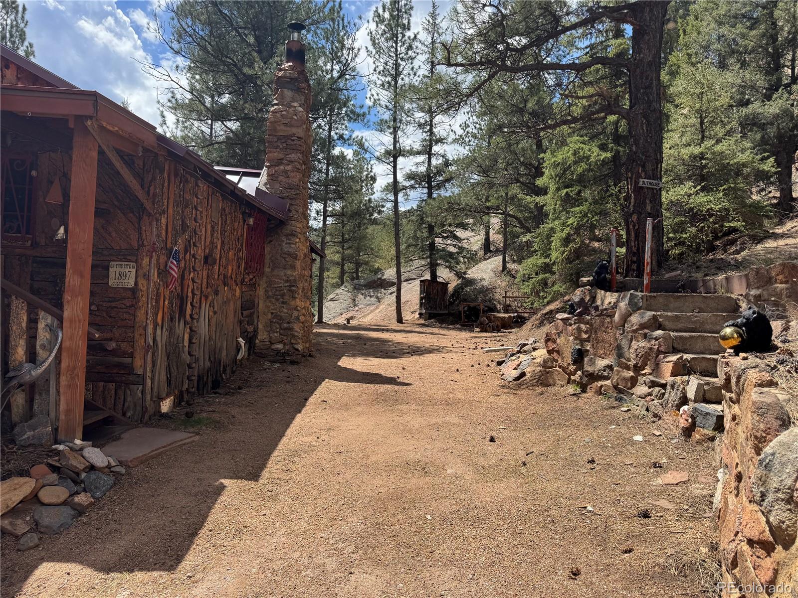 15751 South Elk Creek Road Pine, CO 80470 - Photo 8 of 34 a view of a backyard of the house
