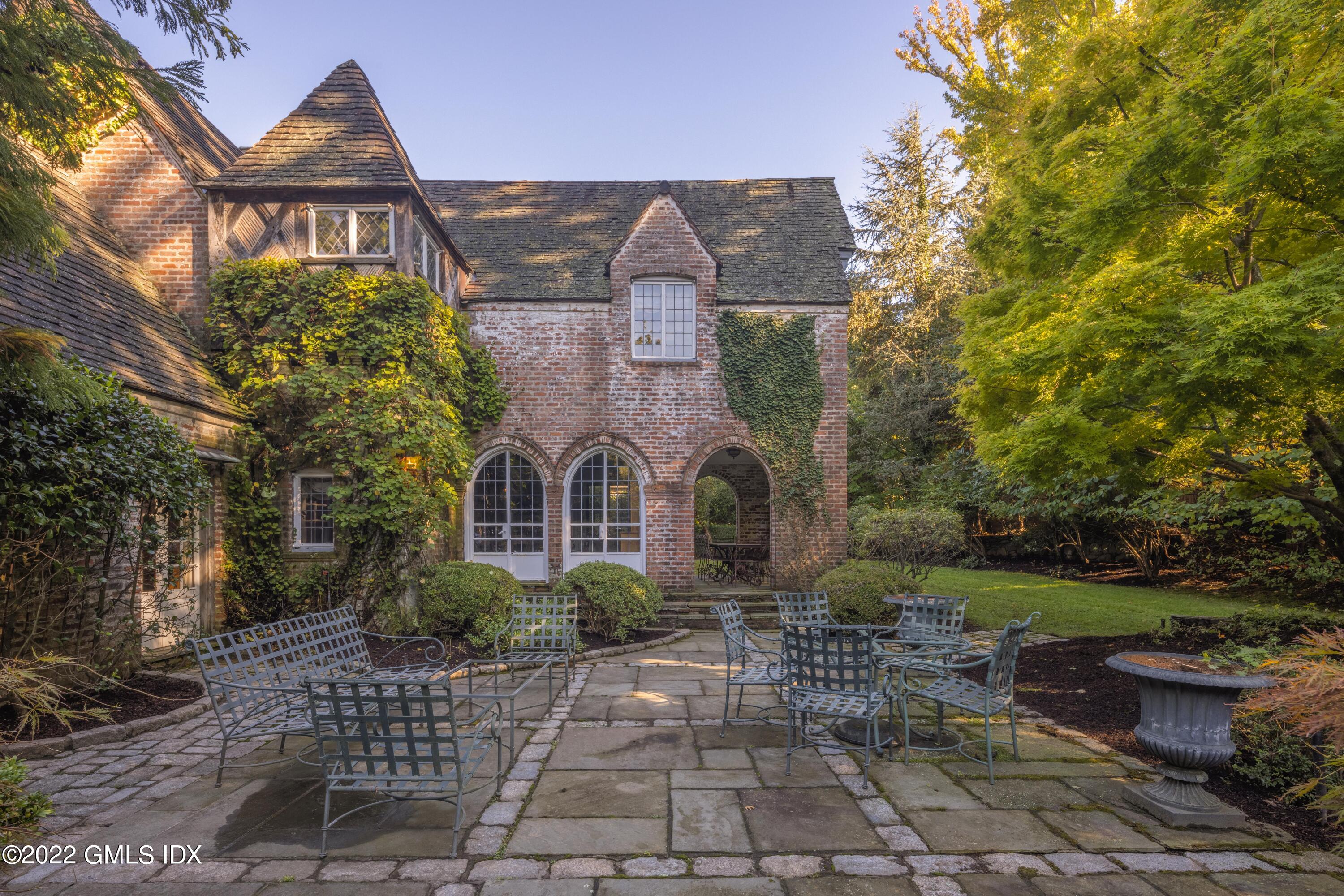 520 Indian Field Road Greenwich, CT 06830 - Photo 14 of 55 a front view of a house with garden