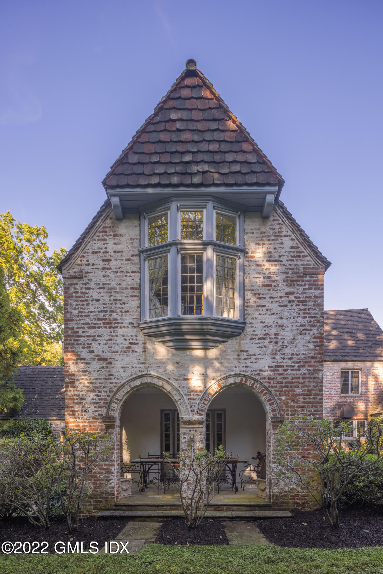 520 Indian Field Road Greenwich, CT 06830 - Photo 17 of 55 a front view of a house with garden