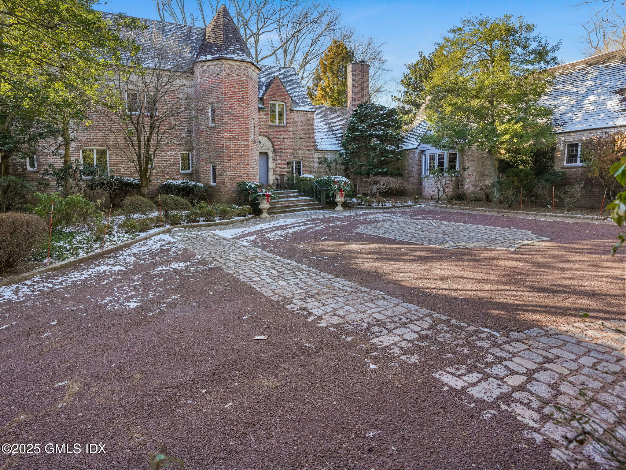 520 Indian Field Road Greenwich, CT 06830 - Photo 3 of 55 a building with trees in front of it