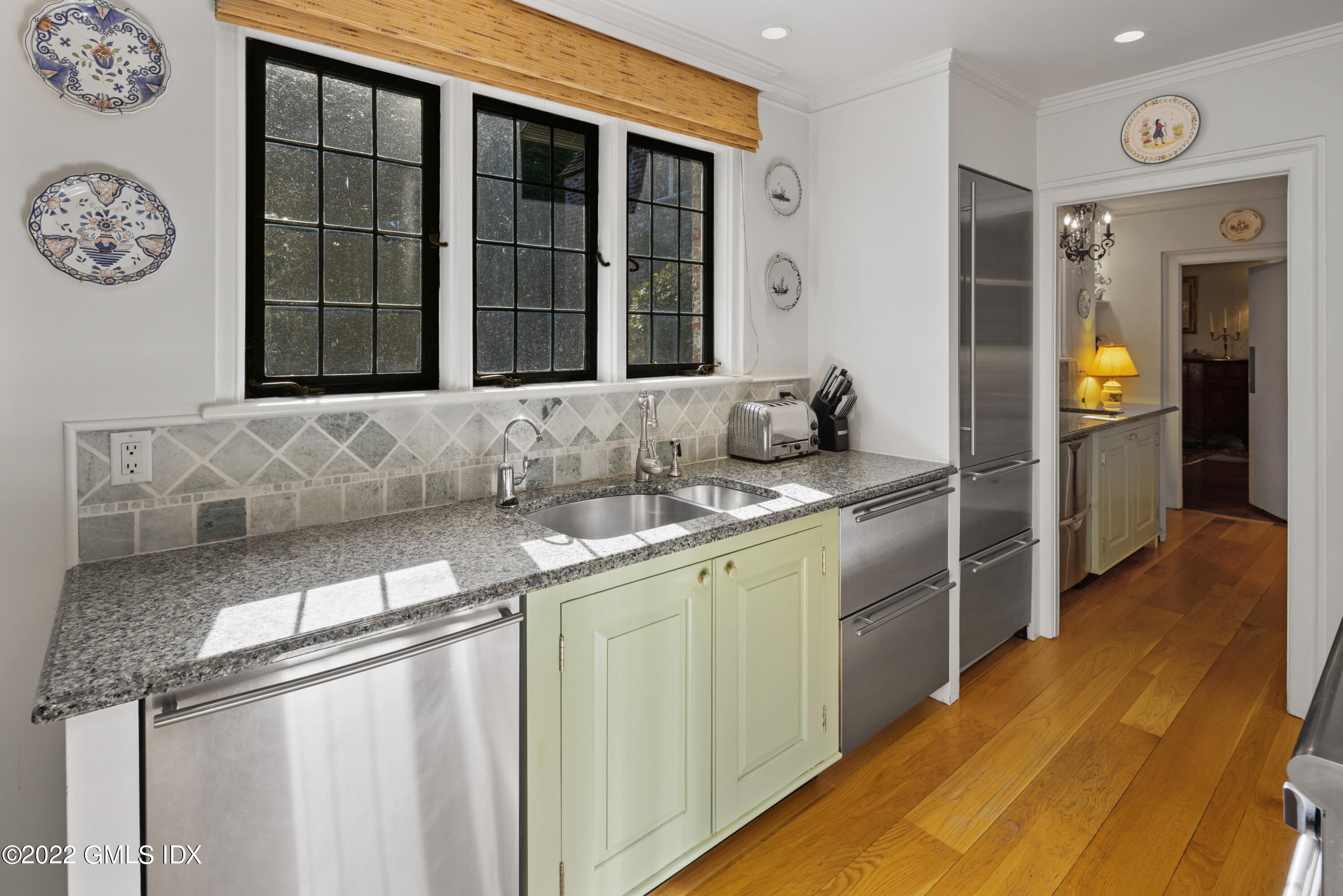 520 Indian Field Road Greenwich, CT 06830 - Photo 34 of 55 a kitchen with a sink and a refrigerator