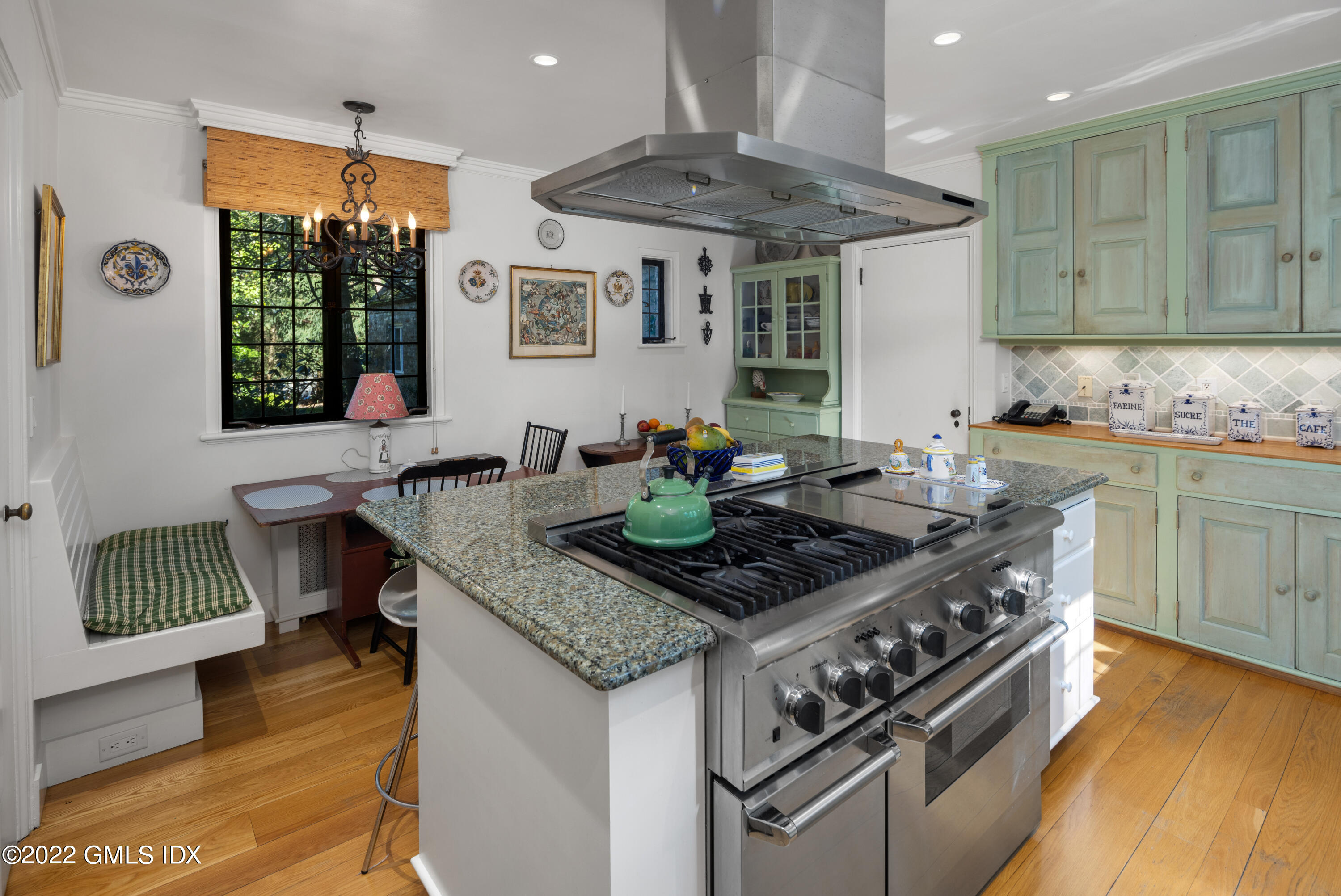 520 Indian Field Road Greenwich, CT 06830 - Photo 35 of 55 a kitchen with a stove a sink and a wooden cabinets