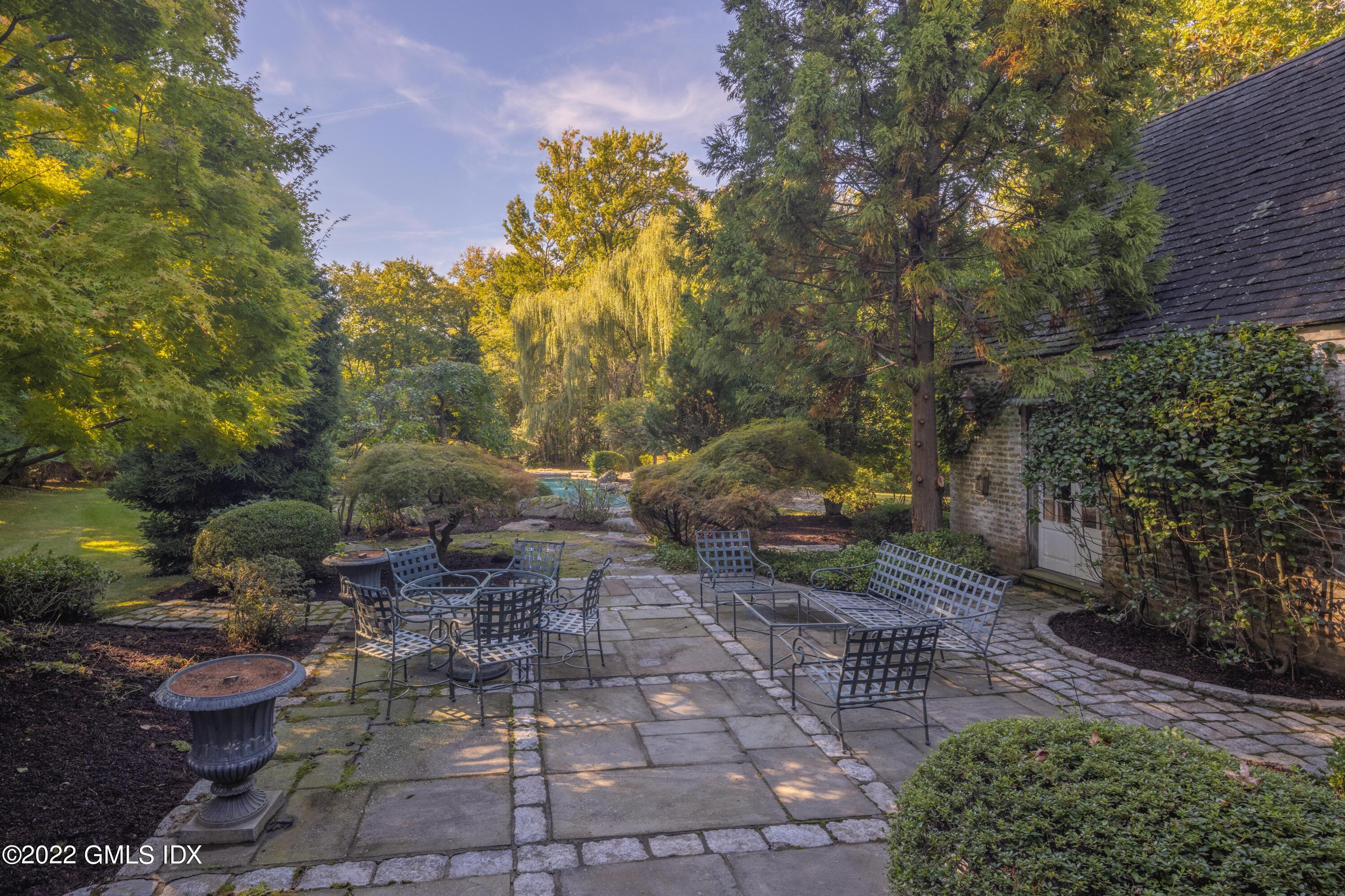 520 Indian Field Road Greenwich, CT 06830 - Photo 43 of 55 a view of a pathway with a yard