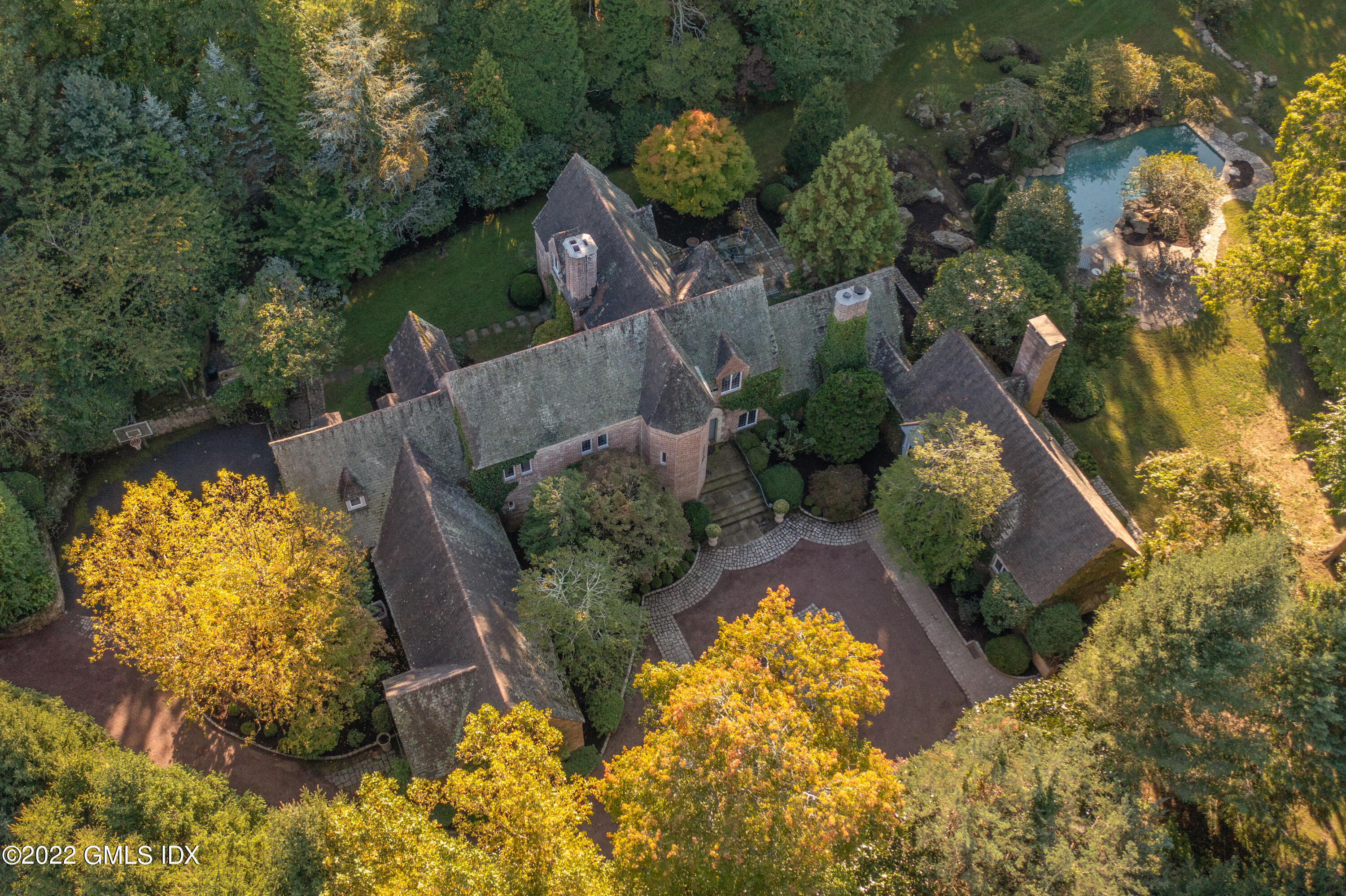 520 Indian Field Road Greenwich, CT 06830 - Photo 8 of 55 an aerial view of house with yard swimming pool and outdoor seating