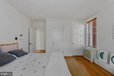 a bedroom with a bed and a table