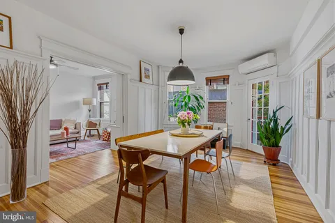 a view of a dining room with furniture and window