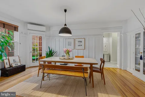 a view of a livingroom with furniture window and wooden floor