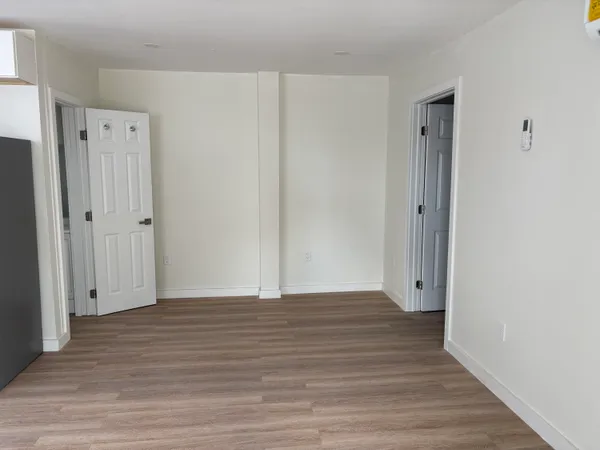 a view of wooden floor in an empty room