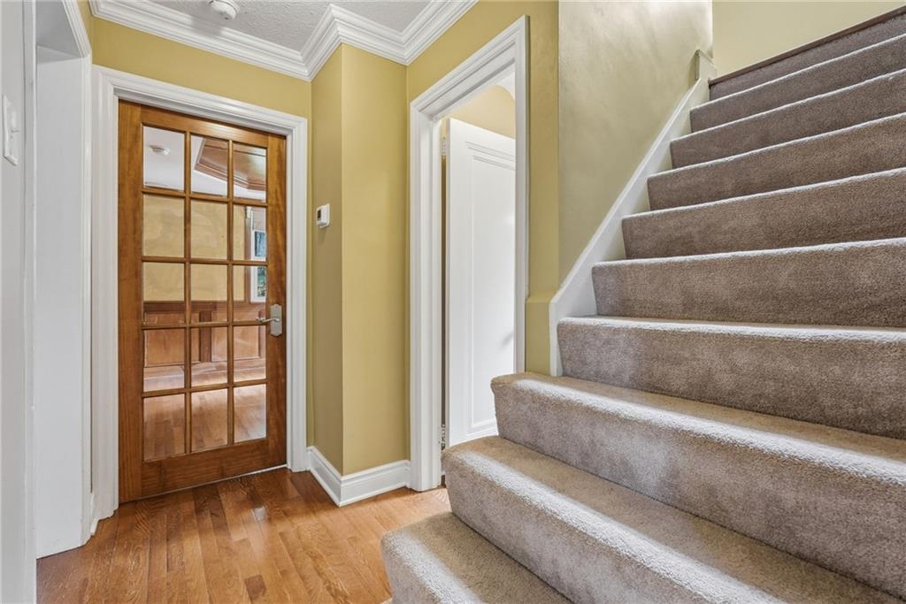809 Franklin Road Mars, PA 16046 - Photo 19 of 44 Staircase to upper level with access to den/ flex room and powder room