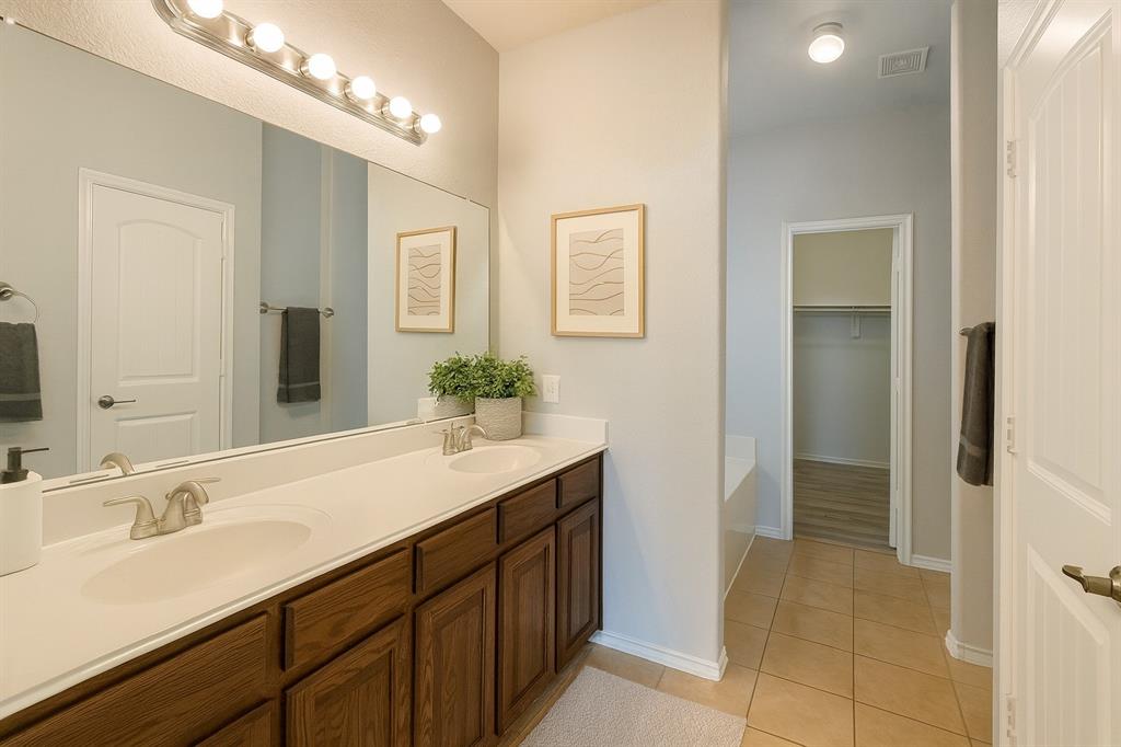 2047 Jack County Drive Forney, TX 75126 - Photo 13 of 20 a bathroom with a sink and a mirror