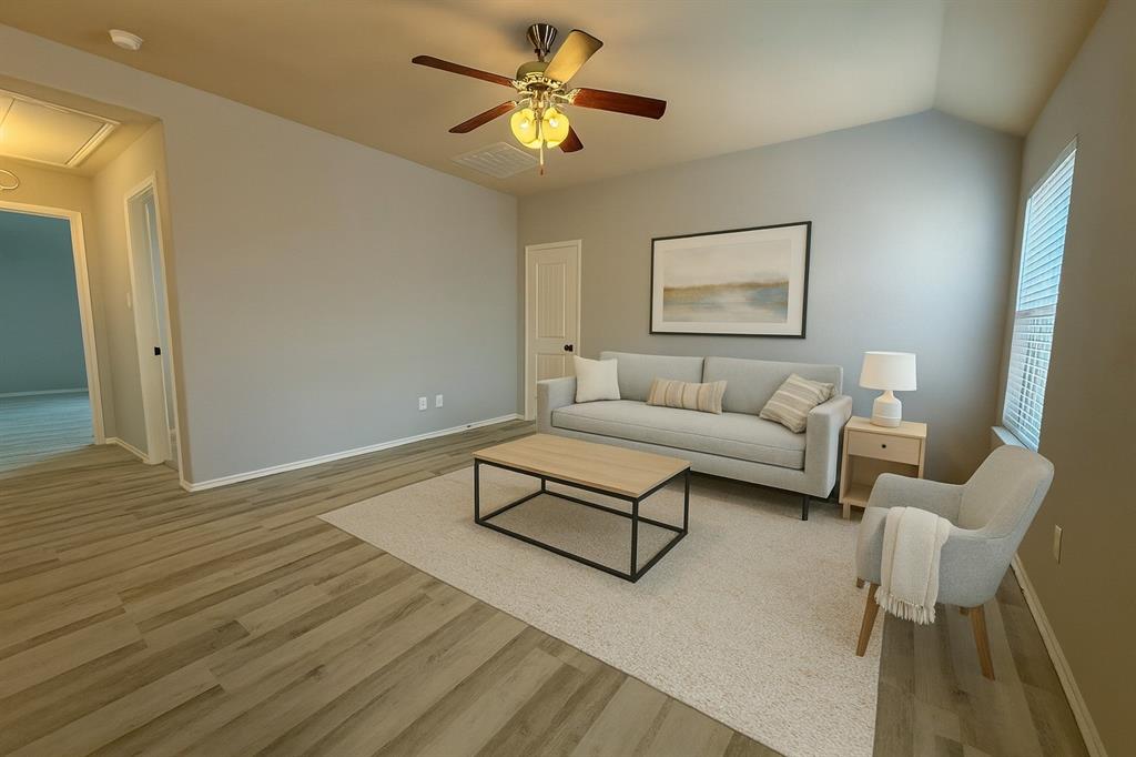 2047 Jack County Drive Forney, TX 75126 - Photo 16 of 20 a living room with furniture and a wooden floor