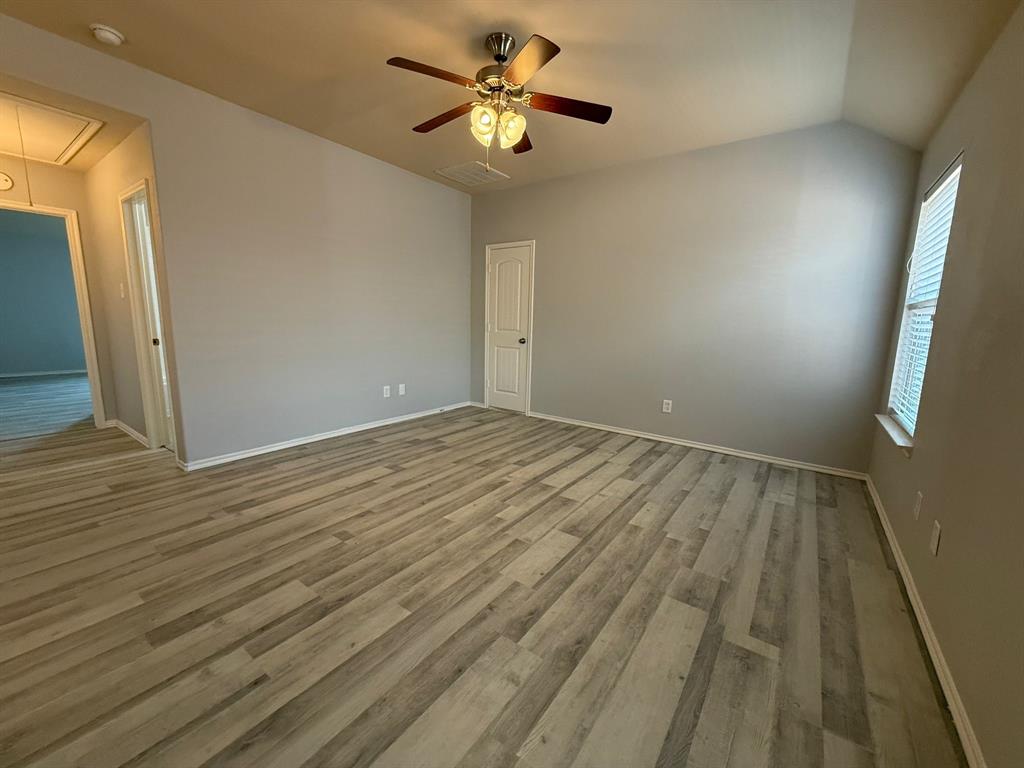 2047 Jack County Drive Forney, TX 75126 - Photo 17 of 20 wooden floor in an empty room with a window
