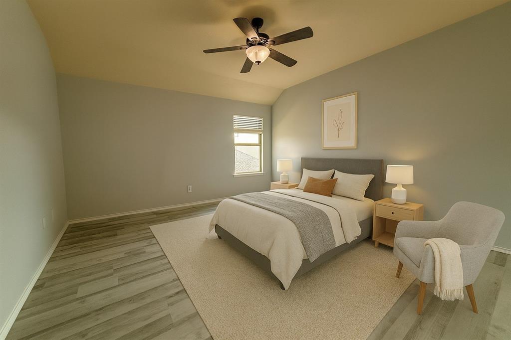 2047 Jack County Drive Forney, TX 75126 - Photo 19 of 20 a bedroom with a bed and a ceiling fan