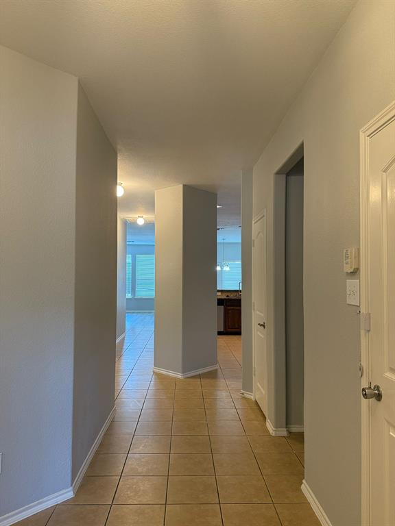 2047 Jack County Drive Forney, TX 75126 - Photo 3 of 20 a view of a hallway with closet and a bathroom