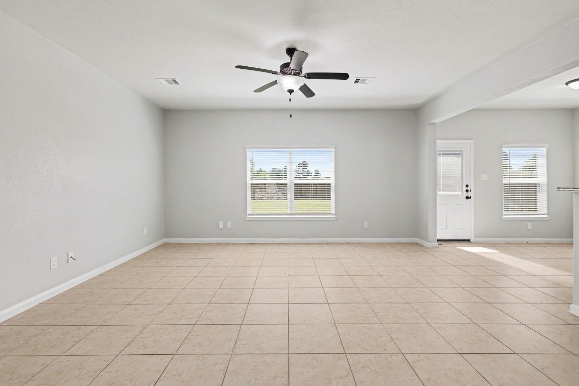 7722 Boulder Sunstone Lane Conroe, TX 77304 - Photo 7 of 25 a view of an empty room with a window