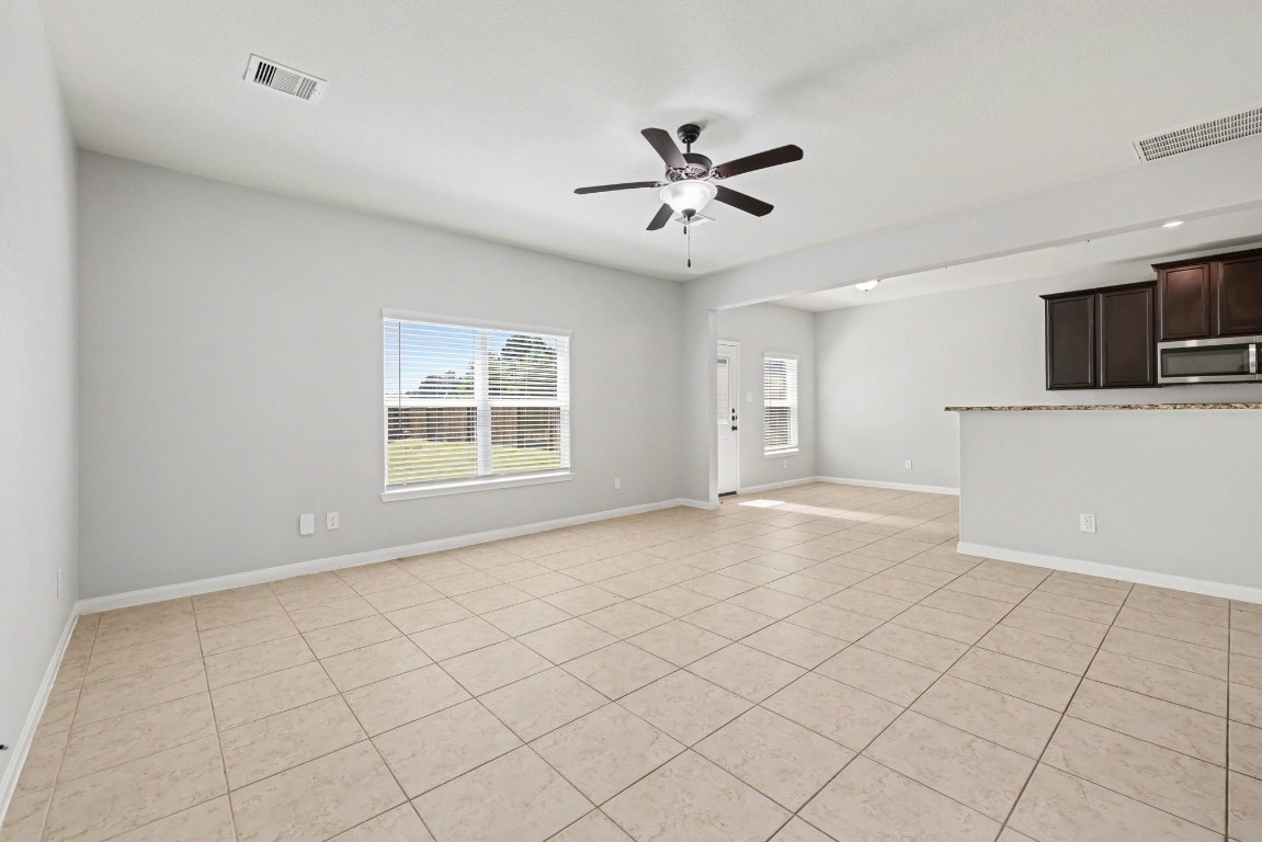 7722 Boulder Sunstone Lane Conroe, TX 77304 - Photo 9 of 25 a view of an empty room with a window