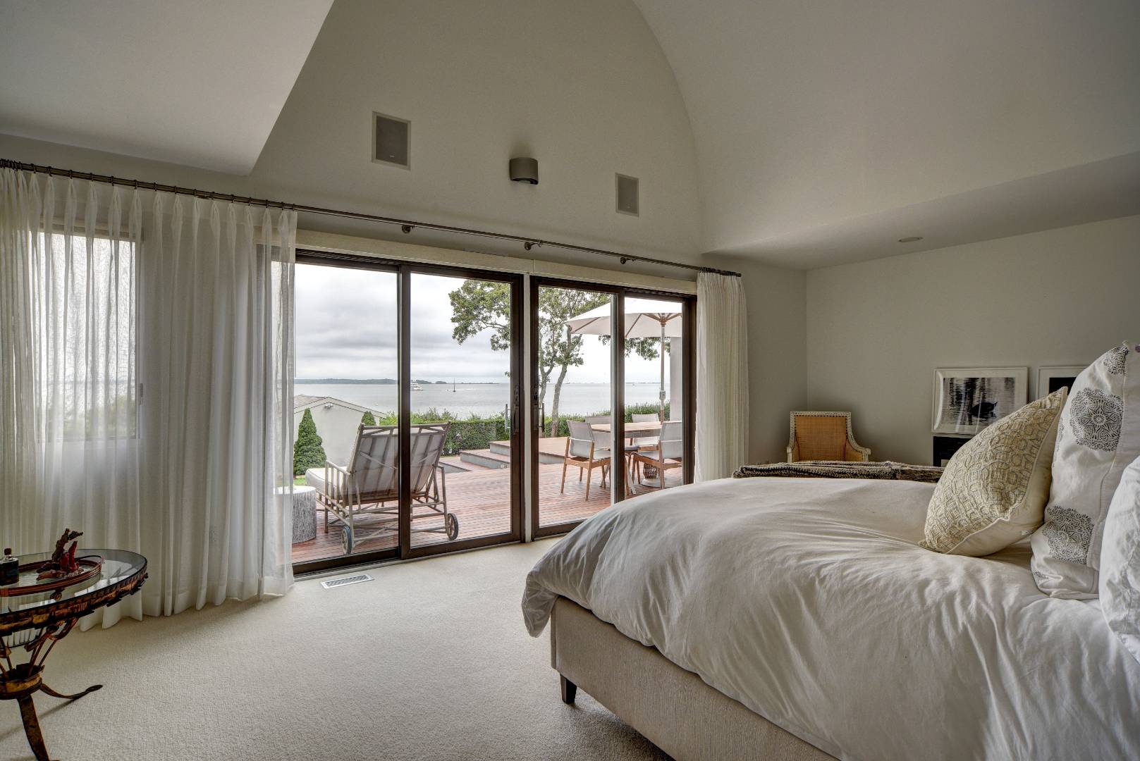 18 Sound View Drive Sag Harbor, NY 11963 - Photo 12 of 28 a spacious bedroom with a bed and a large window
