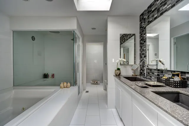 a bathroom with a bathtub and a sink