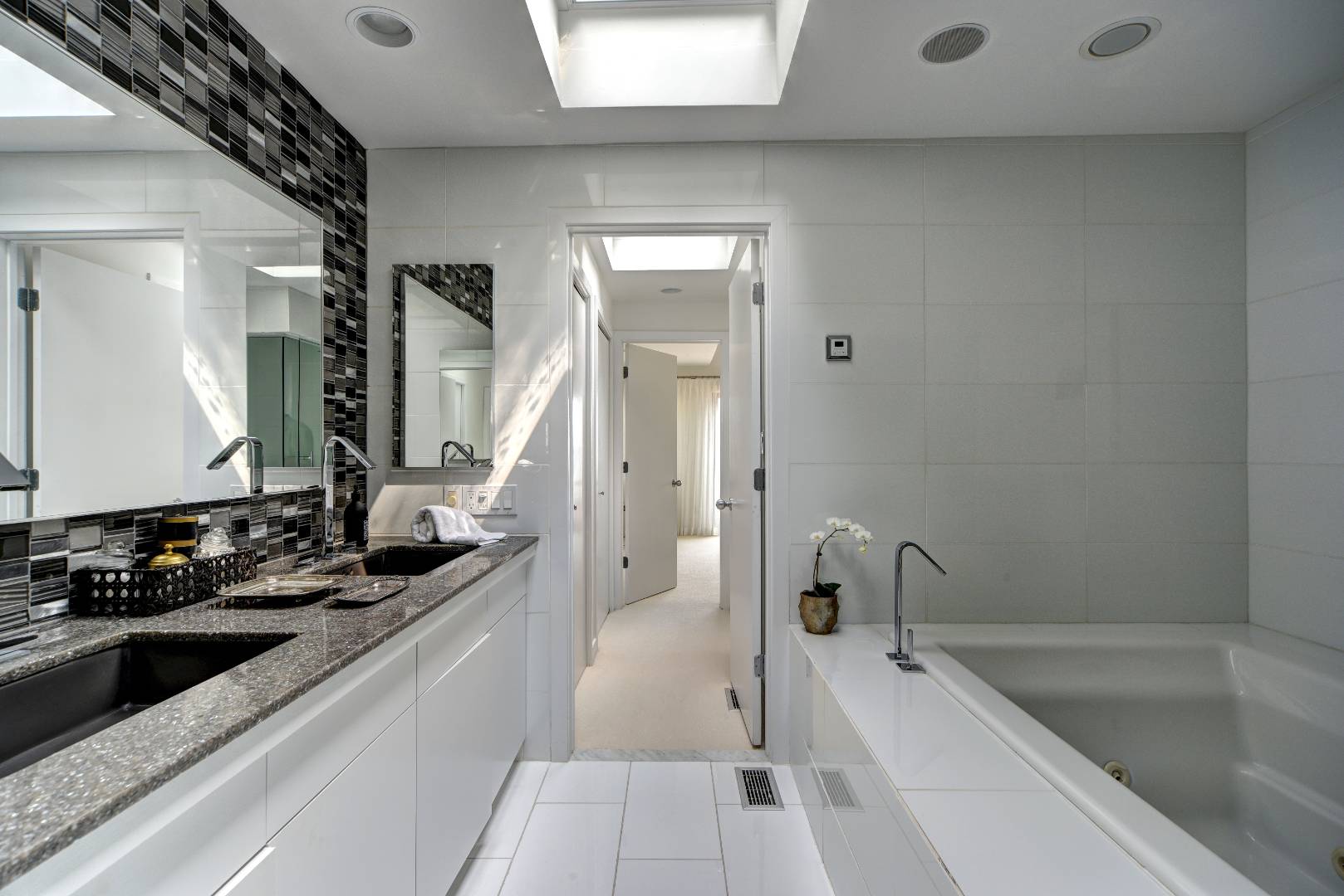 18 Sound View Drive Sag Harbor, NY 11963 - Photo 14 of 28 a bathroom with a bathtub and a sink