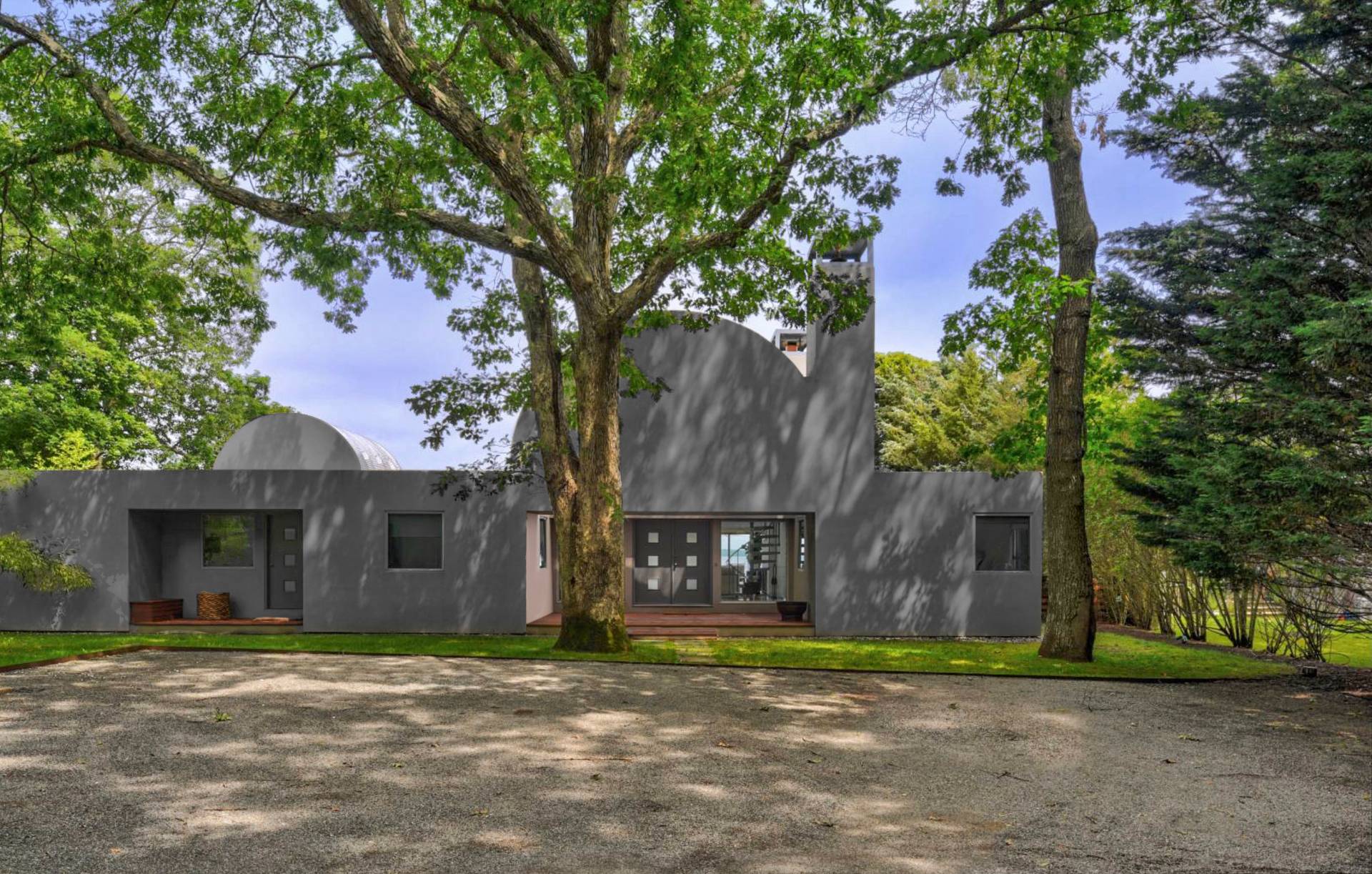 18 Sound View Drive Sag Harbor, NY 11963 - Photo 2 of 28 a front view of a house with a yard and garage