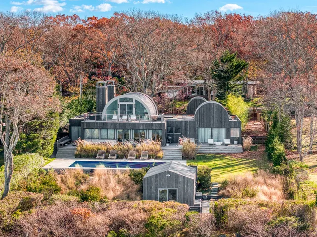 a front view of house with outdoor space and swimming pool