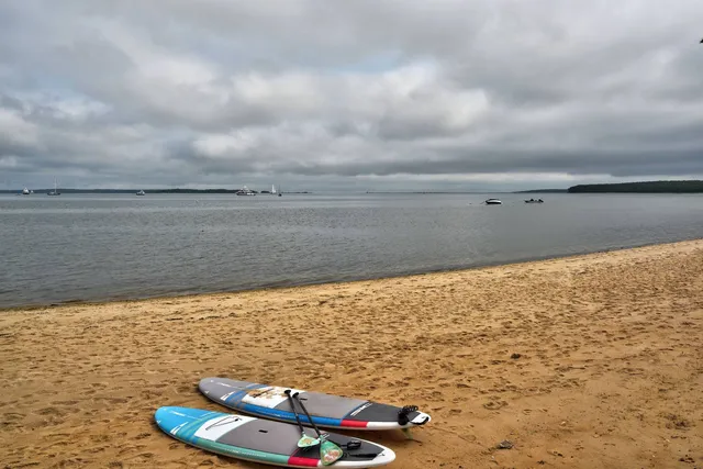 a view of a balcony next to a yard
