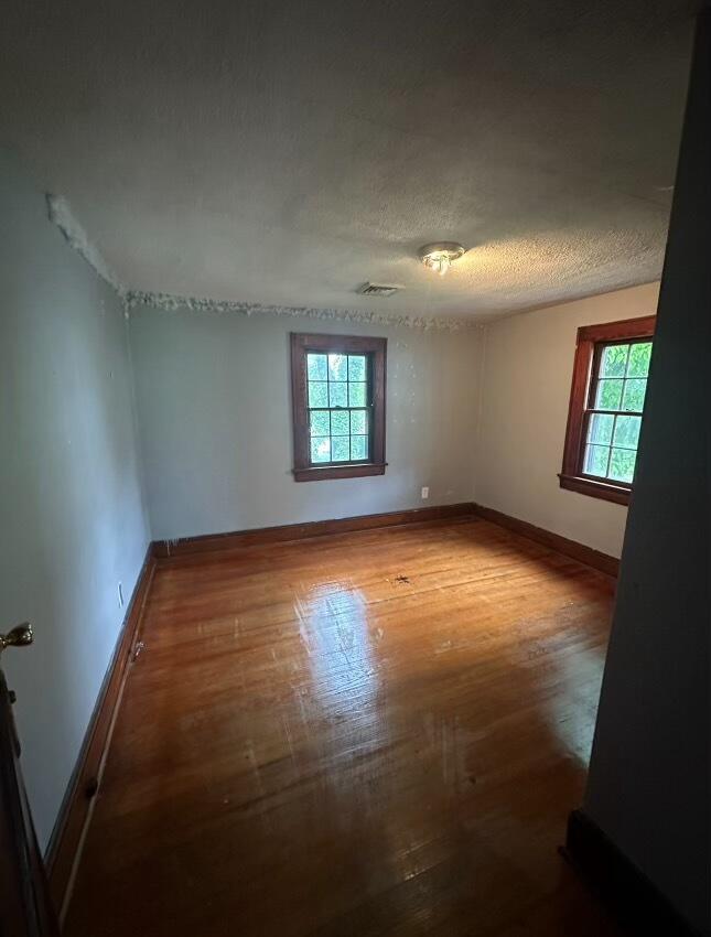 1815 Riverdale Road Southeast Roanoke, VA 24014 - Photo 9 of 10 an empty room with windows