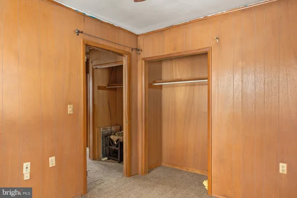 a view of a livingroom with furniture and windows