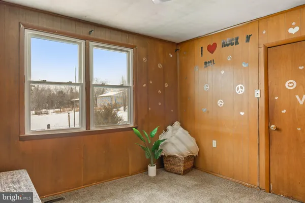 a bathroom with a toilet and a shower curtain