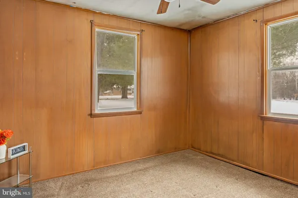 a bathroom with a shower curtain and a toilet