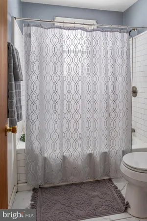 a view of a house with snow on the road