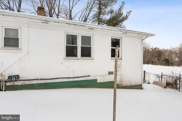 a view of a yard with a snow