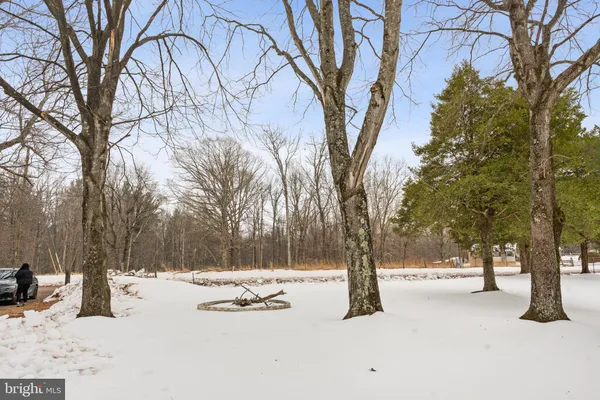 a view of of snow with wooden fence