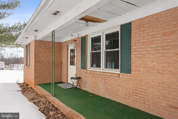 a view of house with backyard