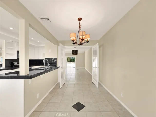 a view of a kitchen with a sink and dishwasher