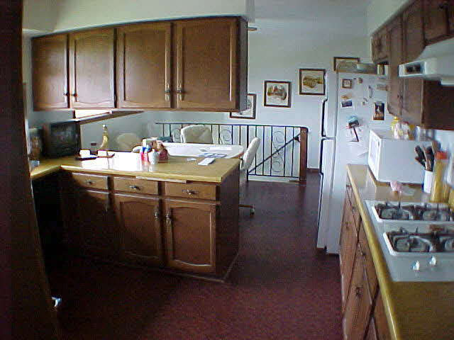 11311 Smith Road Pecatonica, IL 61063 - Photo 4 of 5 a room with cabinets and wooden floor