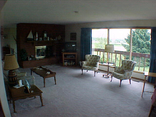 11311 Smith Road Pecatonica, IL 61063 - Photo 5 of 5 a living room with furniture and a fireplace