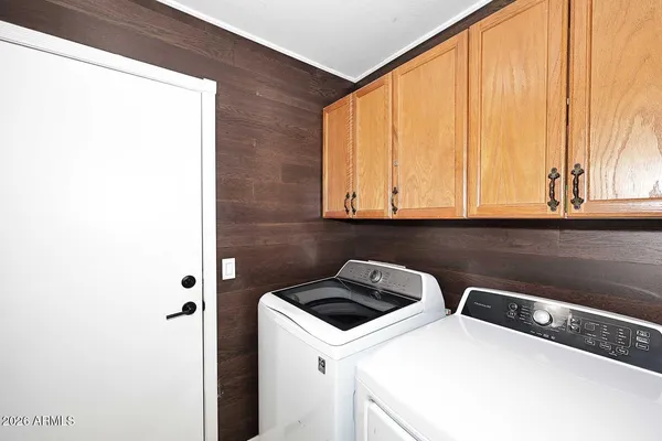 a utility room with dryer and washer