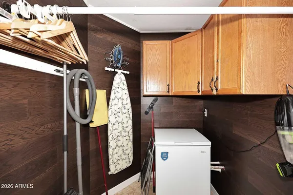 a view of a livingroom with furniture and a window
